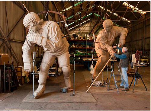 CNC milled foam model of “Le Magnifique” being coated with clay to prepare for bronze casting CNC milled foam model of “Le Magnifique” being coated with clay to prepare for bronze casting
